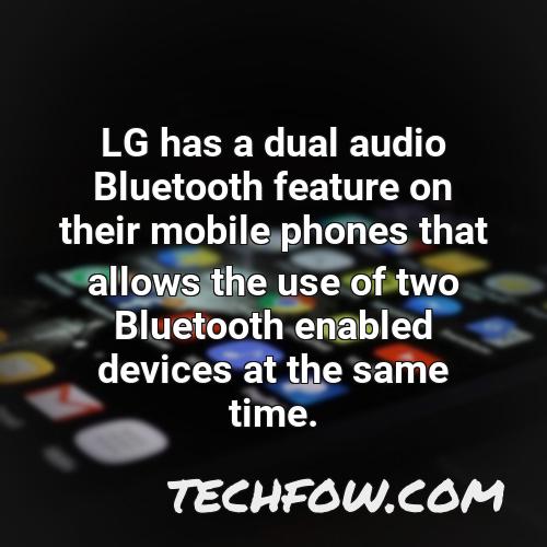 lg has a dual audio bluetooth feature on their mobile phones that allows the use of two bluetooth enabled devices at the same time