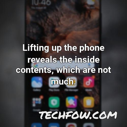 lifting up the phone reveals the inside contents which are not much