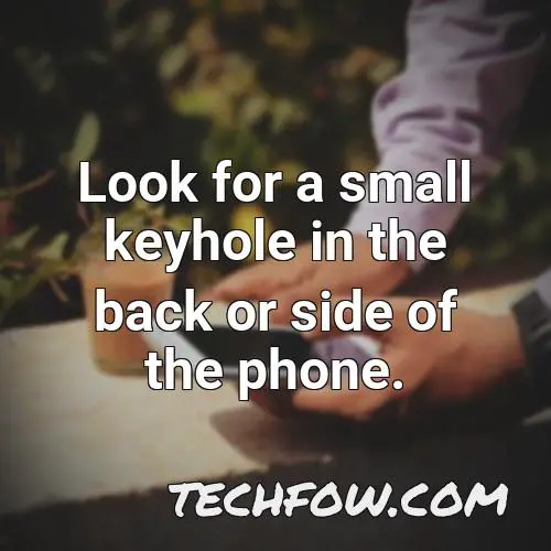 look for a small keyhole in the back or side of the phone