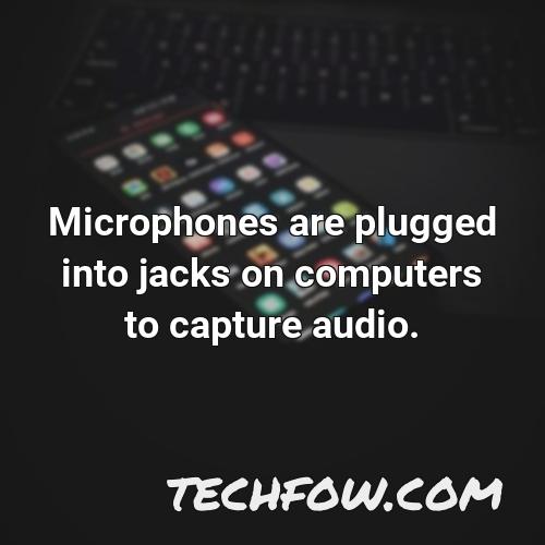 microphones are plugged into jacks on computers to capture audio