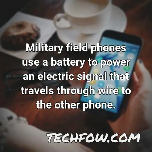 military field phones use a battery to power an electric signal that travels through wire to the other phone