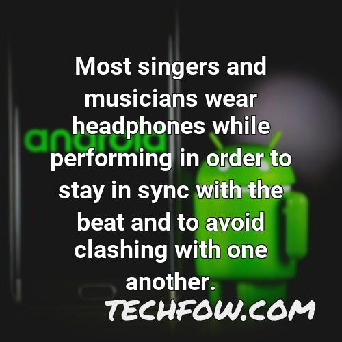 most singers and musicians wear headphones while performing in order to stay in sync with the beat and to avoid clashing with one another