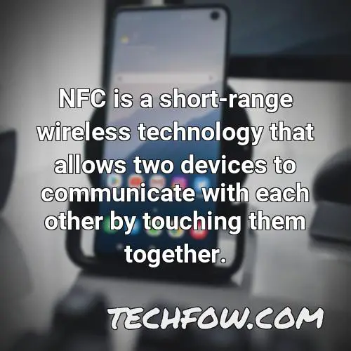 nfc is a short range wireless technology that allows two devices to communicate with each other by touching them together
