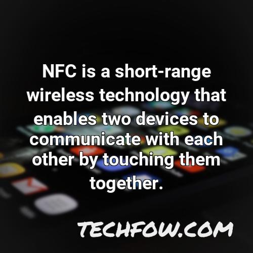 nfc is a short range wireless technology that enables two devices to communicate with each other by touching them together