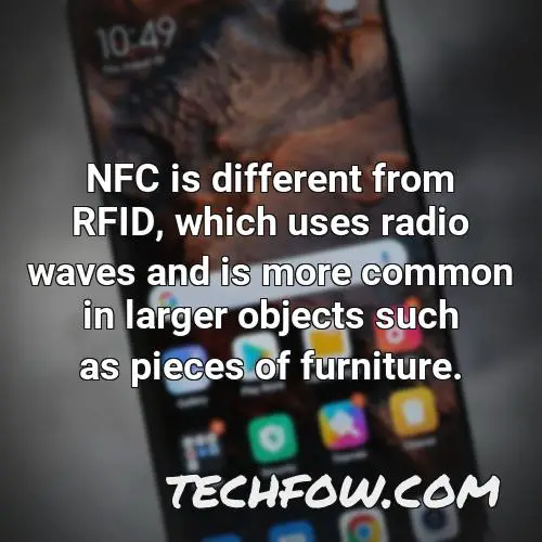 nfc is different from rfid which uses radio waves and is more common in larger objects such as pieces of furniture