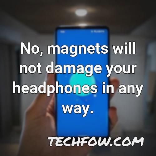 no magnets will not damage your headphones in any way