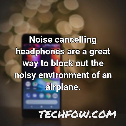 noise cancelling headphones are a great way to block out the noisy environment of an airplane