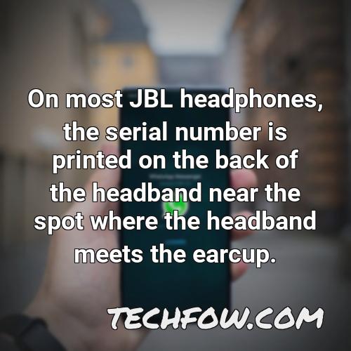 on most jbl headphones the serial number is printed on the back of the headband near the spot where the headband meets the earcup