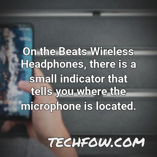 on the beats wireless headphones there is a small indicator that tells you where the microphone is located