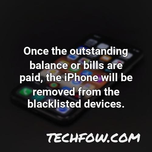 once the outstanding balance or bills are paid the iphone will be removed from the blacklisted devices
