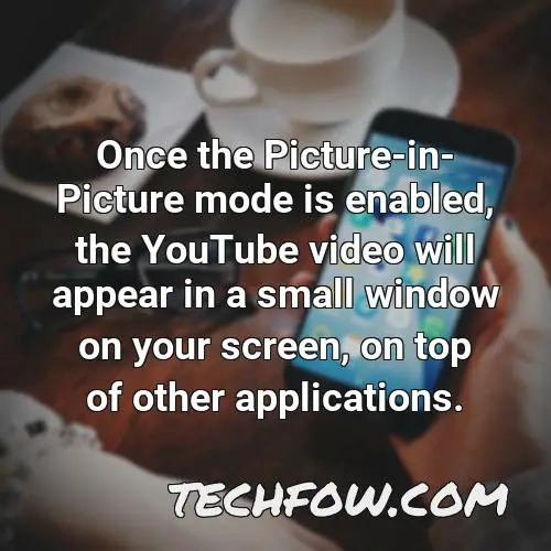 once the picture in picture mode is enabled the youtube video will appear in a small window on your screen on top of other applications