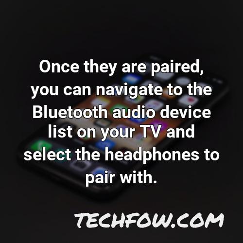 once they are paired you can navigate to the bluetooth audio device list on your tv and select the headphones to pair with