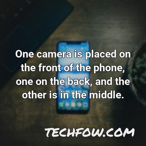 one camera is placed on the front of the phone one on the back and the other is in the middle