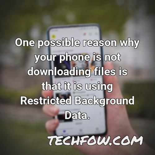 one possible reason why your phone is not downloading files is that it is using restricted background data