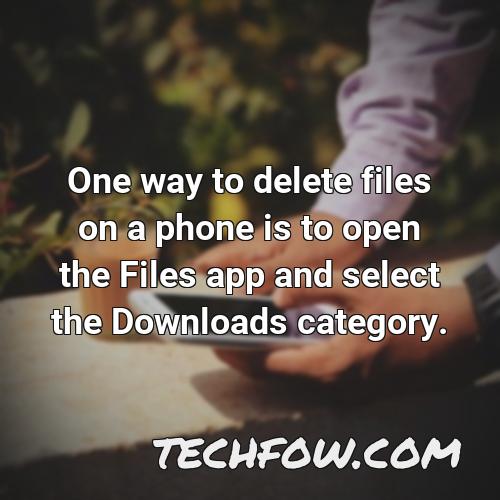 one way to delete files on a phone is to open the files app and select the downloads category
