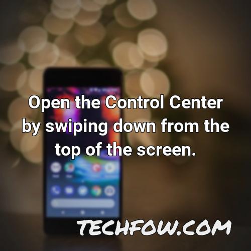 open the control center by swiping down from the top of the screen