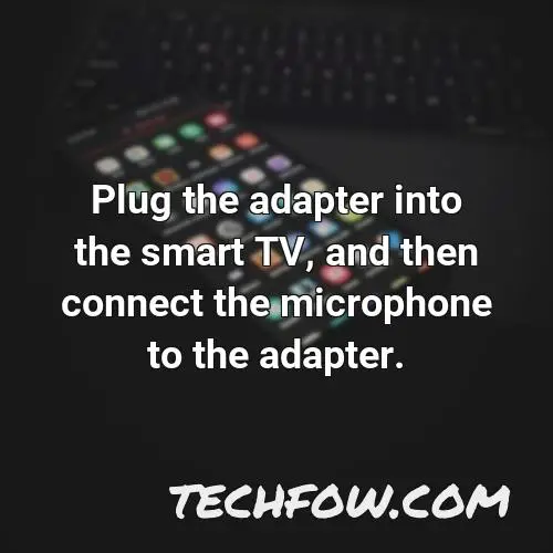plug the adapter into the smart tv and then connect the microphone to the adapter