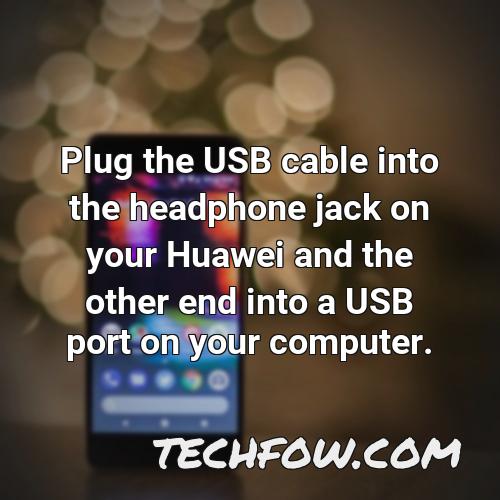 plug the usb cable into the headphone jack on your huawei and the other end into a usb port on your computer