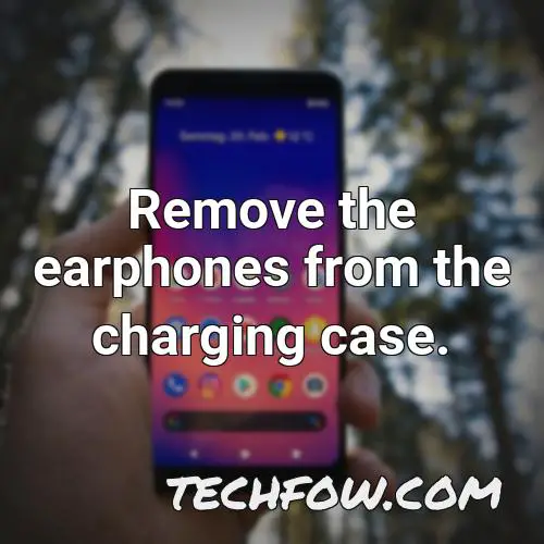 remove the earphones from the charging case