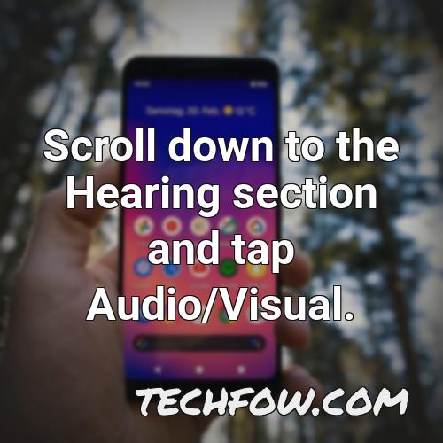 scroll down to the hearing section and tap audio visual