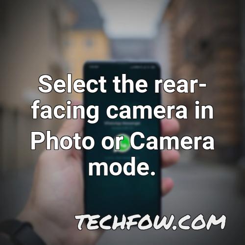 select the rear facing camera in photo or camera mode