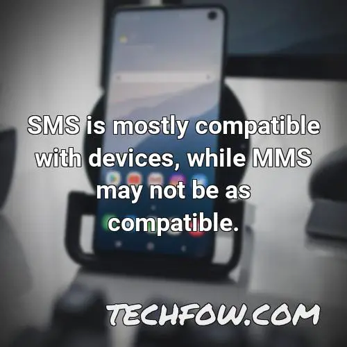 sms is mostly compatible with devices while mms may not be as compatible