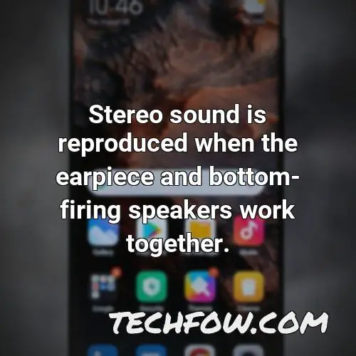 stereo sound is reproduced when the earpiece and bottom firing speakers work together