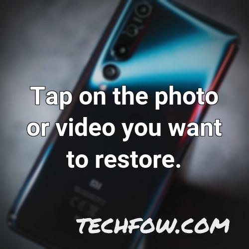 tap on the photo or video you want to restore