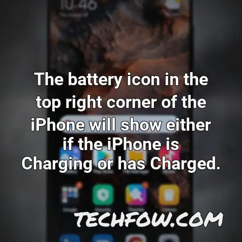 the battery icon in the top right corner of the iphone will show either if the iphone is charging or has charged