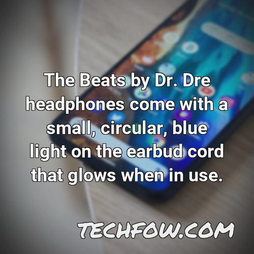 the beats by dr dre headphones come with a small circular blue light on the earbud cord that glows when in use