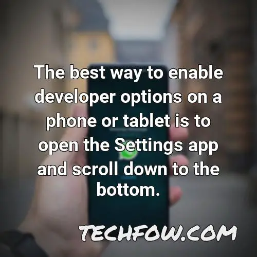 the best way to enable developer options on a phone or tablet is to open the settings app and scroll down to the bottom
