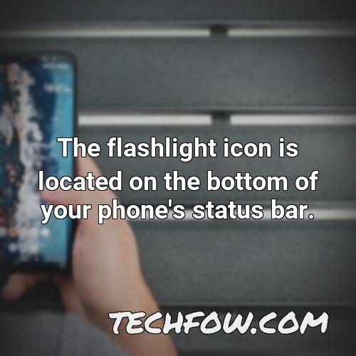 the flashlight icon is located on the bottom of your phone s status bar