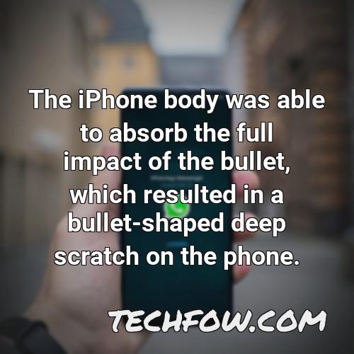the iphone body was able to absorb the full impact of the bullet which resulted in a bullet shaped deep scratch on the phone