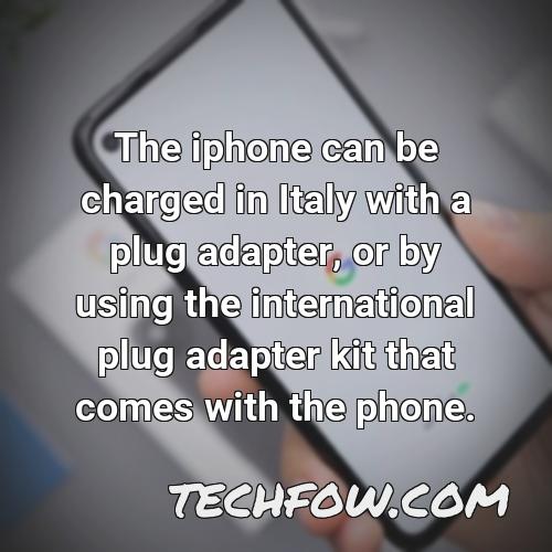 the iphone can be charged in italy with a plug adapter or by using the international plug adapter kit that comes with the phone