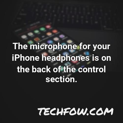 the microphone for your iphone headphones is on the back of the control section