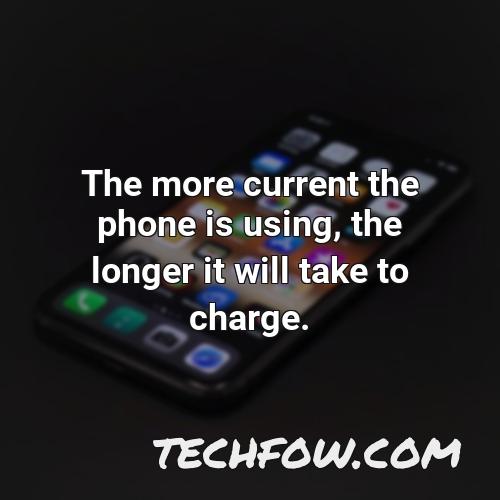 the more current the phone is using the longer it will take to charge