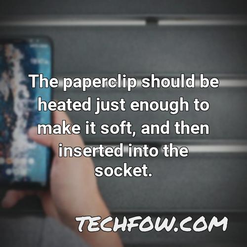 the paperclip should be heated just enough to make it soft and then inserted into the socket