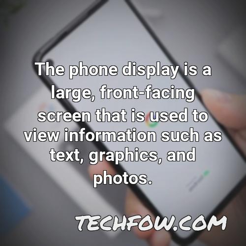 the phone display is a large front facing screen that is used to view information such as text graphics and photos