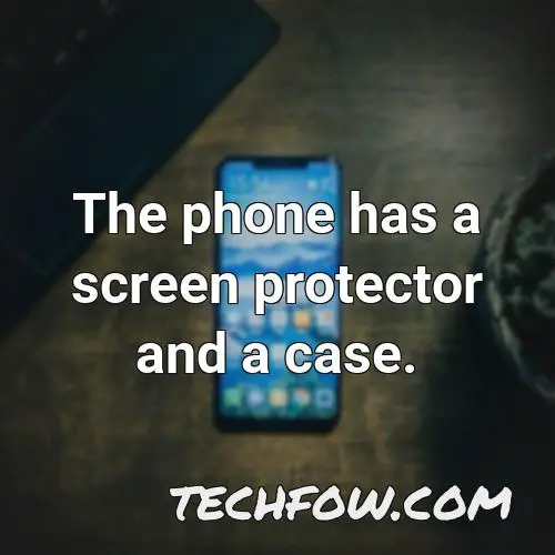 the phone has a screen protector and a case