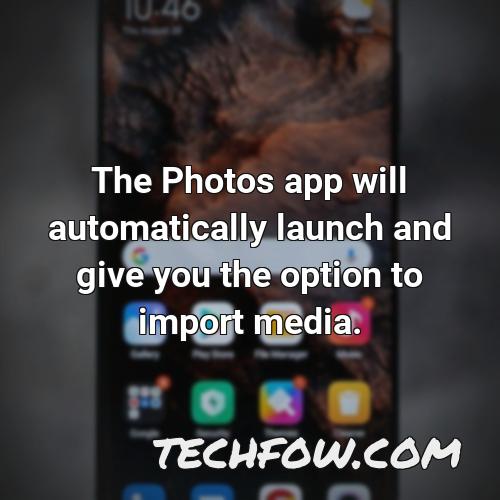 the photos app will automatically launch and give you the option to import media