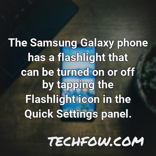 the samsung galaxy phone has a flashlight that can be turned on or off by tapping the flashlight icon in the quick settings panel