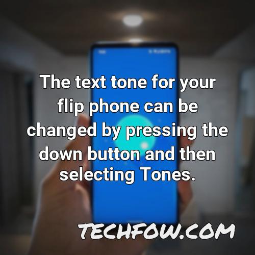 the text tone for your flip phone can be changed by pressing the down button and then selecting tones