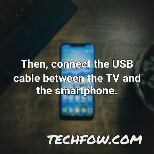 then connect the usb cable between the tv and the smartphone