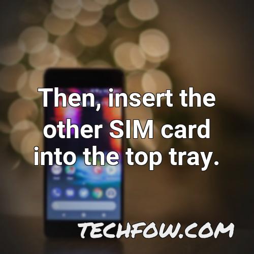 then insert the other sim card into the top tray 1