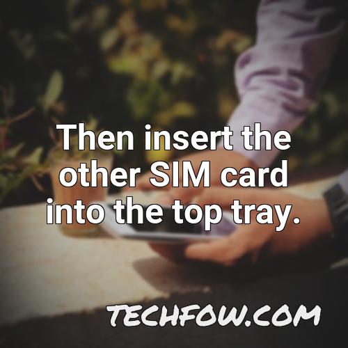 then insert the other sim card into the top tray