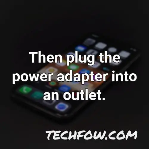 then plug the power adapter into an outlet