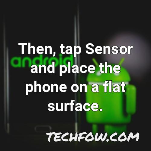 then tap sensor and place the phone on a flat surface