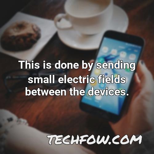 this is done by sending small electric fields between the devices