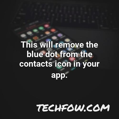 this will remove the blue dot from the contacts icon in your app