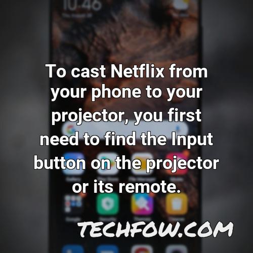 to cast netflix from your phone to your projector you first need to find the input button on the projector or its remote